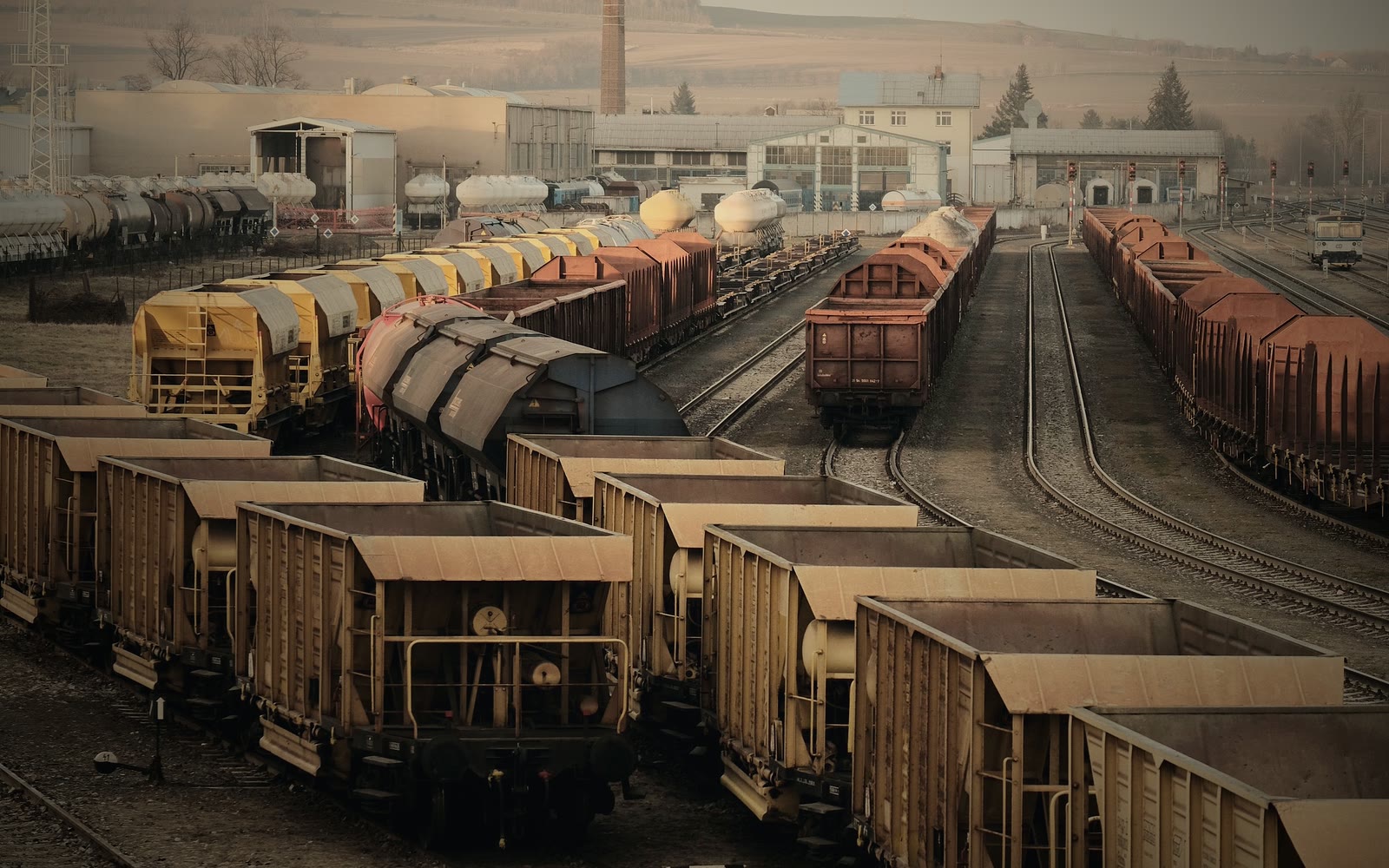A freight rail yard at golden hour
